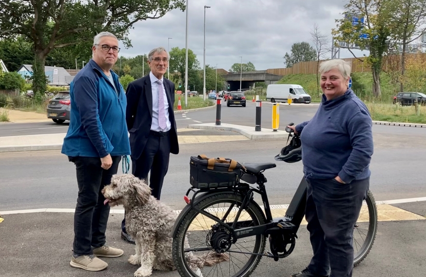 Resident, MP and Cllr on bike
